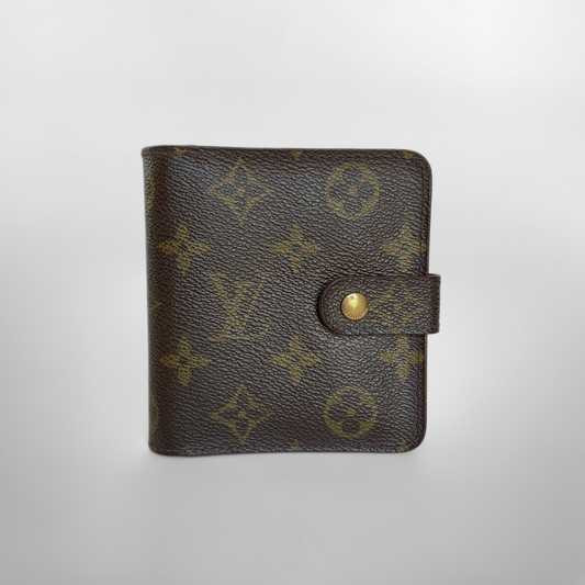Brown leather wallet with gold monogram pattern on a light gray background