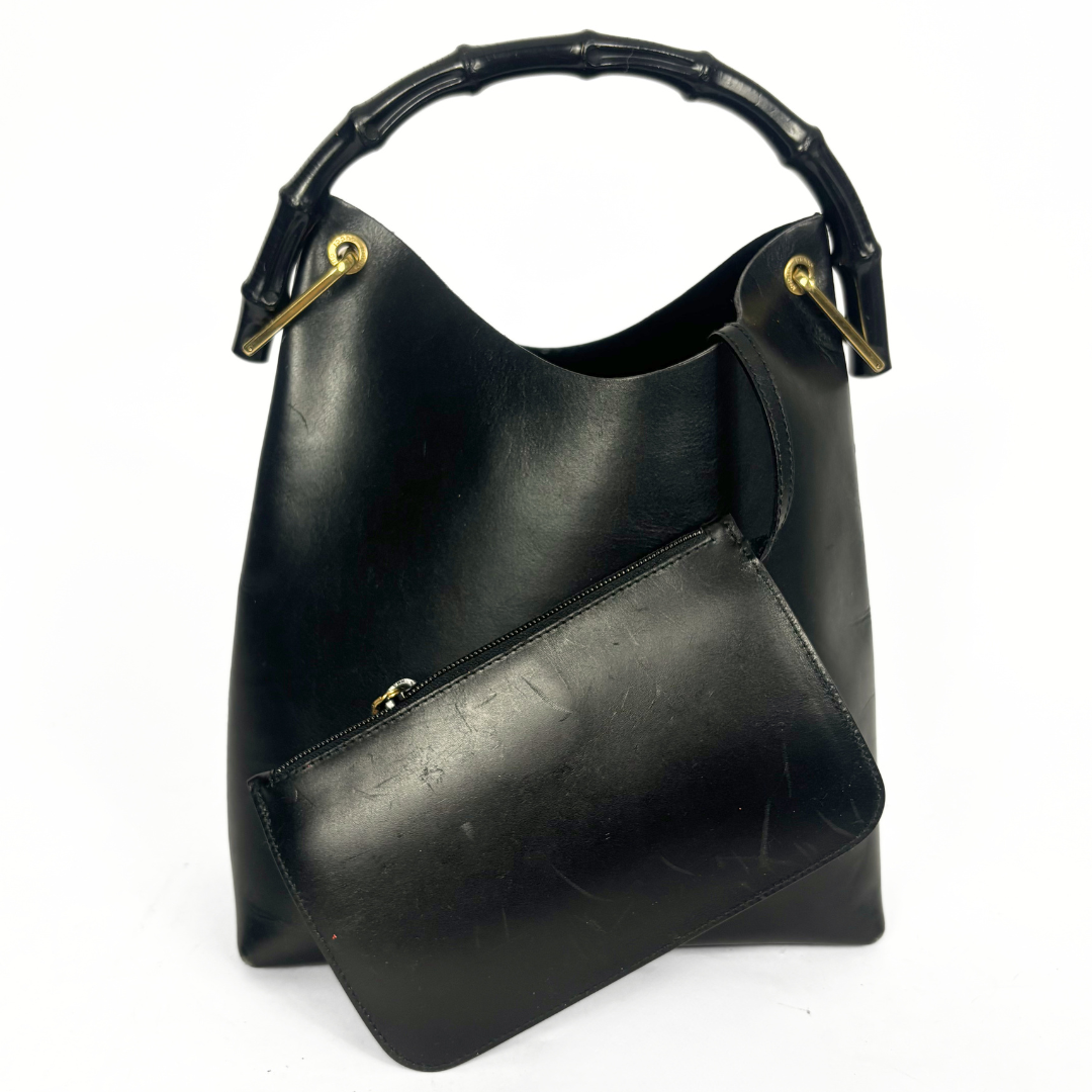 Gucci vintage black leather hobo hag with a dark wood bamboo top handle and gold-tone hardware.