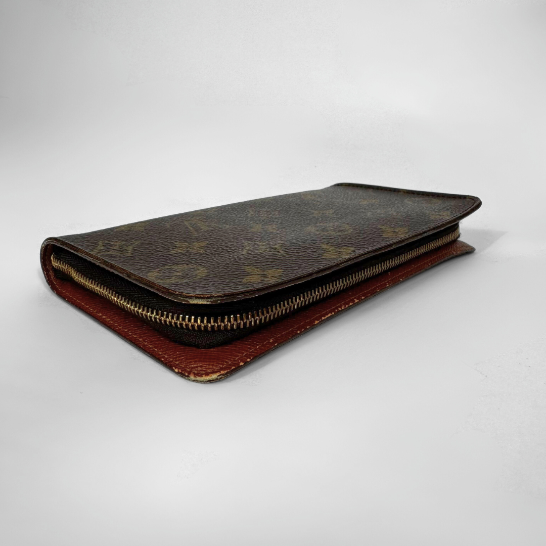 Designer wallet with monogram pattern on a white background