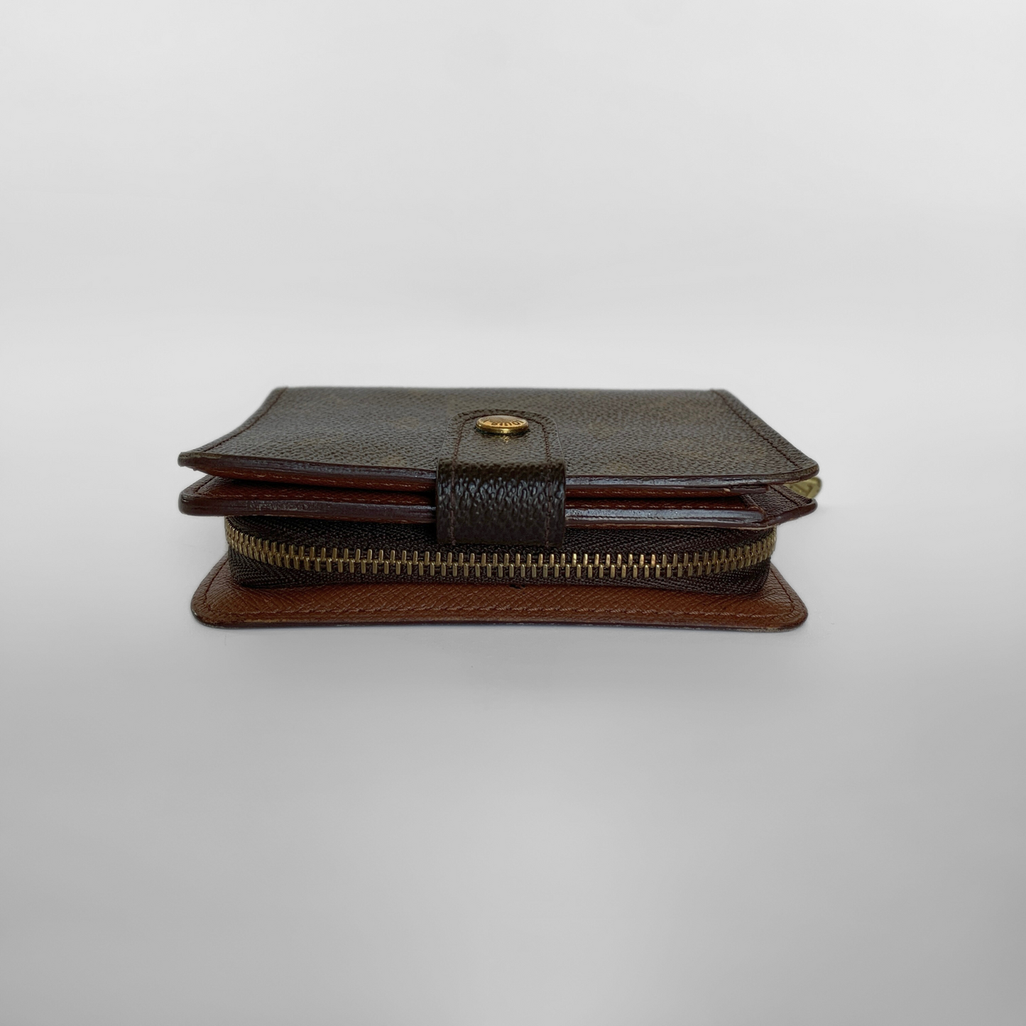 Two-tone leather wallet with zipper on a light gray background
