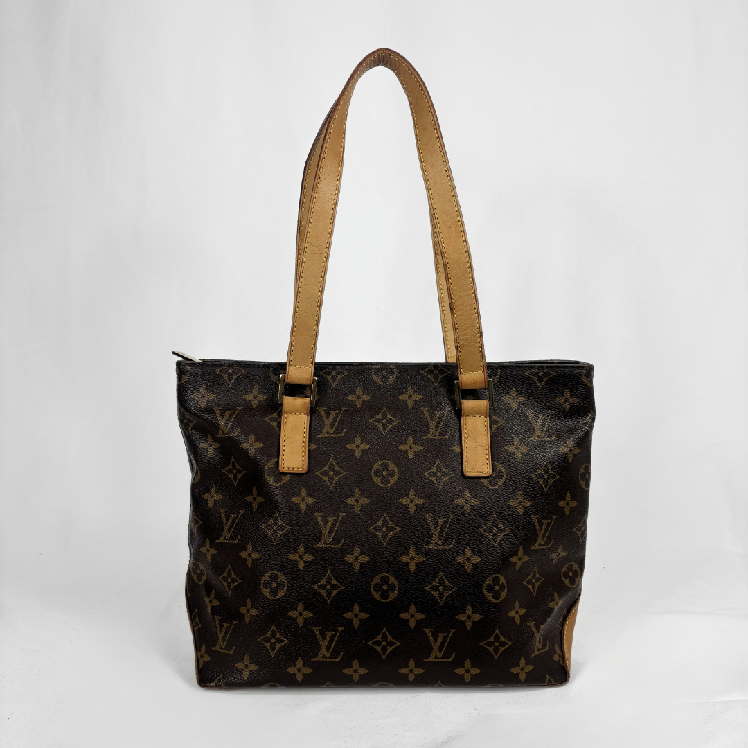 A Louis Vuitton monogram canvas tote bag with tan leather shoulder straps, photographed against a plain white background.