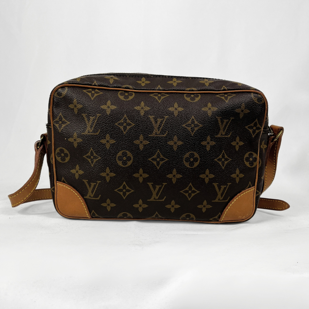 A Louis Vuitton monogram canvas shoulder bag in dark brown and tan, featuring the classic LV monogram pattern and tan leather trim, shown against a white background.