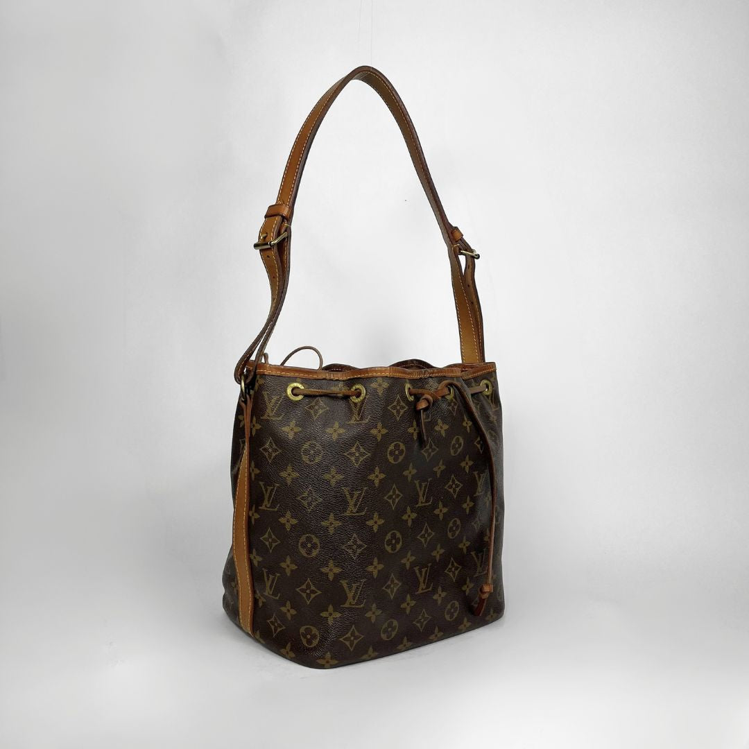 Louis Vuitton monogram canvas shoulder bag with brown leather trim and strap, shown on a light gray background.