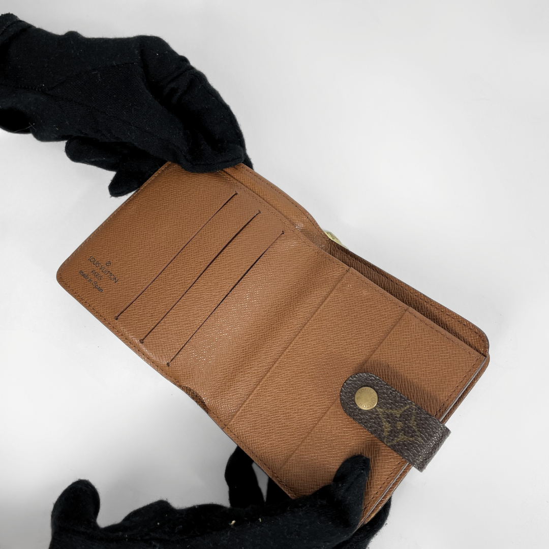 Louis Vuitton Zipper Wallet on a white background