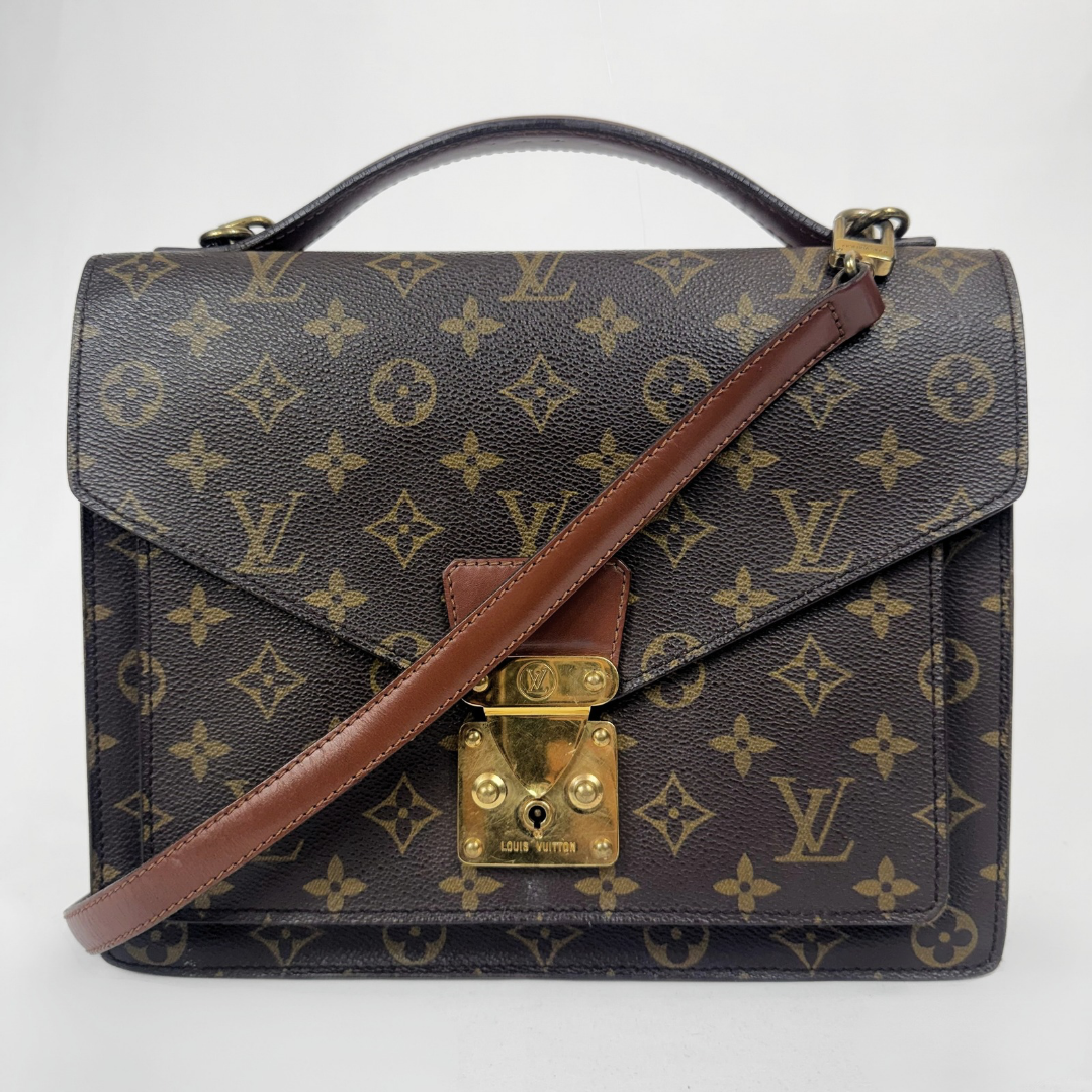 Louis Vuitton monogram canvas shoulder bag with a brown leather handle and strap, gold-tone turn-lock clasp, and front flap closure on a white background.